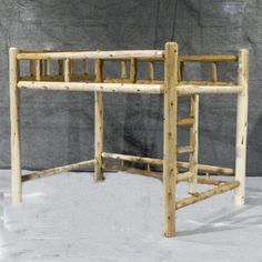 a wooden bunk bed sitting on top of a white floor