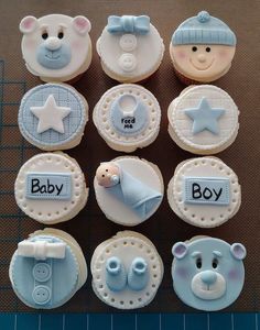 baby shower cupcakes with teddy bears and stars on them