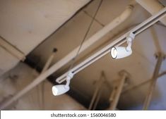 two security lights are hanging from the ceiling