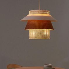 a wooden table with a light hanging over it