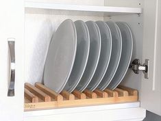 a bunch of plates that are in a cabinet