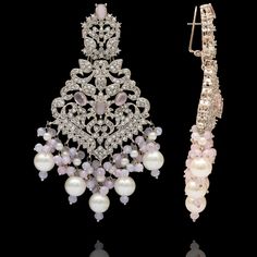 Remarkable heritage jewelry that portrays immaculate precision and technique! Exquisitely crafted earrings with pink and CZ stones along with pink moti and pearl adornments. Approximate earrings length is 4". Silver-plated on high-quality brass as base metal. Made by order. Kindly allow 5-7 weeks for the delivery of this item. For custom or urgent requests, please contact support@alacouture.com. *Please Note: We use faux stones and beads in all of our jewelry. Elegant Pearl Bridal Earrings With Stone Work, Elegant Bridal Earrings With Stone Work And Pearl, Elegant Pink Bridal Earrings With Stone Work, Elegant Pink Earrings With Stone Work, Elegant Pink Earrings For Reception, Elegant Pink Bridal Earrings For Reception, Festive Pink Dangle Pearl Earrings, Festive Pink Pearl Wedding Earrings, Elegant Pink Danglers For Festive Occasions