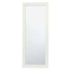 a white framed mirror sitting on top of a wall