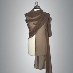 a mannequin with a brown scarf on it