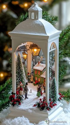 a christmas scene is shown in front of a lit up gazebo with snow on the ground