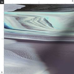 a blurry image of water and sand is shown in the foreground, as if it were an abstract painting