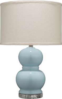 a blue lamp with a white shade on it