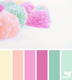 the color scheme is pink, green, yellow and blue with candy hearts on it