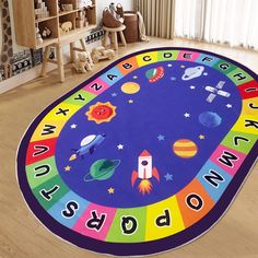 a child's room with a rug that says, abc and w is for space