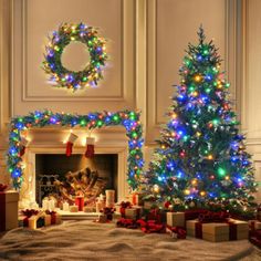 two christmas trees are decorated with multicolored lights and presents in front of a fireplace