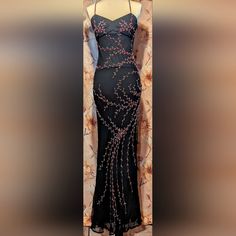 This Dress Is A Stunningly Beautiful Long Black Formal Dress By Cache (Also Known As Sue Wong). Like New. Only Flaw Is Tag Is Missing Size But It Is A Size Small. 100% Silk And Absolutely Flawless With Its Spaghetti Straps And Long To Floor Flowing Beauty. It Is Embellished With Beautiful Red And Clear Sparkly Beading All Over. Low Cut With Beaded And Cross Back Straps . Side Zipper Closure. This Dress Is Mesmerizing!! Pictures Do Not Do It Justice. This Beauty Needs To Be Seen In Person. Never Mesmerizing Pictures, Long Black Formal Dress, Sue Wong Dress, Long Black Dress Formal, Sue Wong Dresses, Black Formal Dress, Sue Wong, Cache Dress, Black Dress Formal