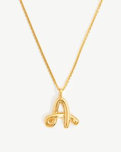 Curly Molten Initial Pendant Necklace - Initial A | 18ct Gold Plated Vermeil. Spell It Out. On a Delicate Trace Chain, this Unique Initial Pendant Necklace Features Your Chosen Letter in a Bespoke Hand-Drawn Font. A Versatile Layering Piece, Keep It for Yourself or Give as the Ultimate Personalized Gift. Metal: 18Ct Gold Plated Vermeil on Recycled Sterling Silver Dimensions: 16 mm X 17. 4mm Chain Length: 500mm with Extensions from 460mm - 500mm Weight: 6. 8g this Piece is Handcrafted with Recycl Letter Pendant Necklace Silver, Birthday 2023, Initial A, Double Chain Necklace, Malachite Necklace, Font A, Leaf Bracelet, Initial Pendant Necklace, Necklace Shop