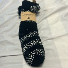 Bear Paw Socks In Black And White Pattern With Pom Pom. Comfortable Soft Pair Of Socks. Sherpa Lined Lounge Socks. Great To Give As A Holiday Gift. Thanks For Looking! Black Breathable Winter Socks, Bear Paw Gloves, Bear Paw Slippers, Bear Fluffy Socks, Playful Black Winter Socks, Paw Socks, Lounge Socks, Paws Socks, Bear Paw