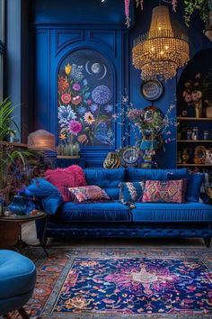 a living room filled with blue furniture and lots of flowers