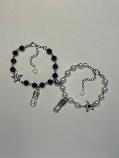 "Handmade matching bracelet set for friends made with black and white beads. Comes with silver flip phone charms and magnetic heart charm. Also comes with 2.5 inch extenders making total length about 9.5\"." Matching Bracelets Black And White, Matching Accessories Best Friends, Flip Phone Charms, Matching Jewelry Best Friends, Matching Bracelets Ideas, Matching Bracelets For Best Friends, Sisyphus Happy, Black And White Beaded Bracelet, Tech Decor