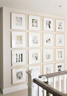 there are many pictures on the wall in this room, and one is holding a baby's crib