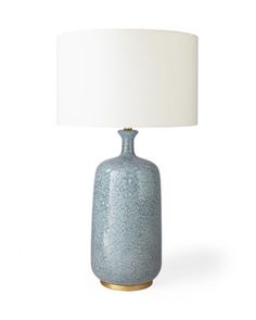 a blue table lamp with a white shade