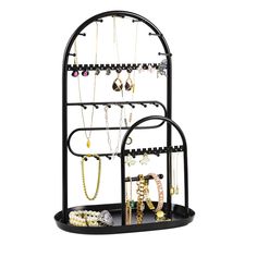 a black jewelry rack with multiple necklaces and bracelets hanging from it's sides