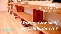 a wooden shelf with books on it in front of a window and japanese text reading making low shelf sugi ashbata diy