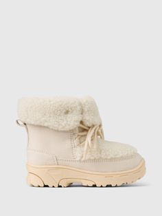 These boots are made with vegan suede and cozy sherpa upper.  Lace-up styling.  Rubber gripper sole.  Zipper at side.  Sherpa lining.  For more fit and sizing info, check out our Size Guide.