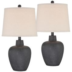 two gray ceramic lamps with white linen shades