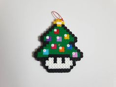 a christmas tree ornament made out of legos