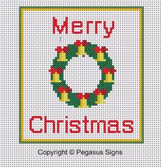 a cross stitch christmas card with a wreath