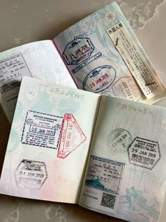 three passport stamps are placed on top of each other