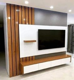 a large flat screen tv mounted to the side of a wall