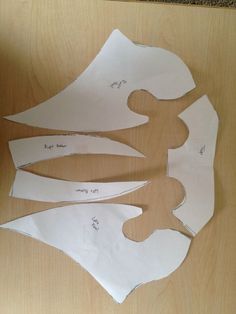 three pieces of paper are cut out to look like the shape of an elephant's head