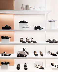 there are many pairs of shoes on the shelves