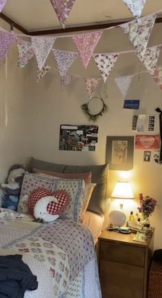 a bed room with a neatly made bed and lots of decorations