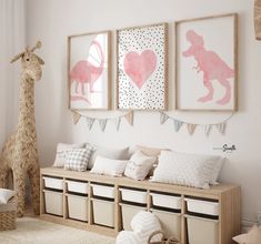 a child's room decorated in pink, white and beige with llamas on the wall