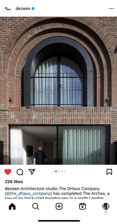 an instagramted photo of a brick building with arched windows