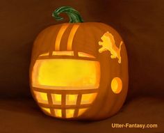 a pumpkin carved to look like a football helmet