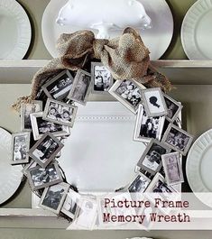 a white plate topped with a wreath filled with pictures and photos next to other plates