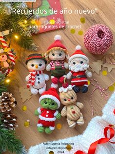 crocheted christmas ornaments are displayed on a wooden table with pine cones and garlands