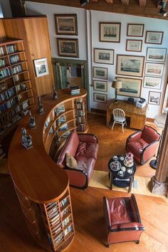 a living room filled with furniture and lots of books