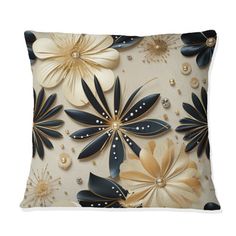 a decorative pillow with black and gold flowers on the front, along with pearls in the back