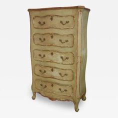 an antique chest of drawers with gold paint