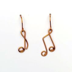 the earrings are made out of copper wire and have a trefoil design on them