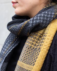 a close up of a person wearing a scarf