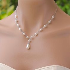 "Vanessa pearl backdrop necklace is a romantic and sweet Bridal necklace if you're a bride wanting a delicate touch to your wedding gown. Ivory White Swarovski pearls and silver lined glass beads are hand linked to create a Y necklace and completed with a rhodium chain . This style is very flattering to your décolletage and will suit most bridal necklines. Measurements: 16\" or 18\". ( 2\"extender can be added if NO backdrop is selected - Please request this at checkout) Pendant drop - 1 1/4\" ( Necklace For Gown, Drop Pearl Necklace, Bijoux Art Nouveau, Backdrops Necklace, Bridal Pearl Necklace, Pearl Necklace Wedding, Pearl Earrings Wedding, Necklace Swarovski, Custom Jewelry Ideas