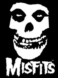 a white skull with the words misfits on it's face in front of a black background