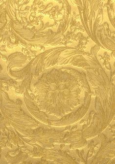 an ornate gold background with swirls and leaves