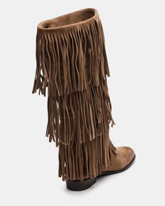 Upgrade your wardrobe with the SPUR fringe boot. These boots feature a fringe detailing that adds a touch of effortless style. Perfect for any occasion, these boots will elevate your look while providing comfort and durability. 1 inch heel height 14.5 inch shaft circumference 15 inch shaft height Suede upper material Synthetic lining Leather sock Synthetic sole Fit tip: If you are in between sizes, size up a half-size Imported Winter Suede Boots With Tassels, Casual Suede Fringe Boots, Casual Fringe Boots For Fall, Brown Fringe Winter Boots, Casual Leather Fringe Boots, Leather Fringe Boots For Fall, Winter Fringe Ankle Boots, Boots Street Style, Suede Fringe Boots