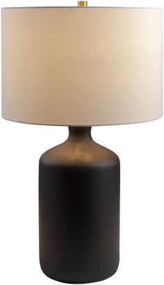 a black table lamp with a white shade on it's base and a gold trim around the top