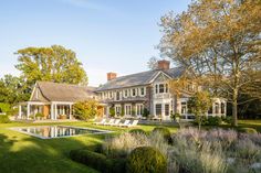 a large house with a pool in the front yard