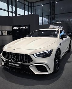 the mercedes amg coupe is on display at an auto show