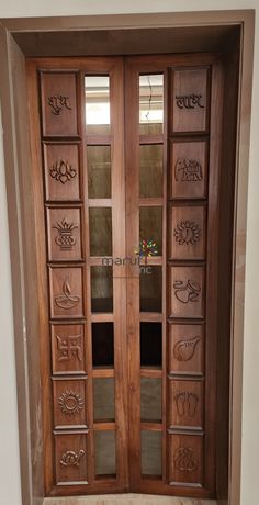 an ornate wooden door with glass panels